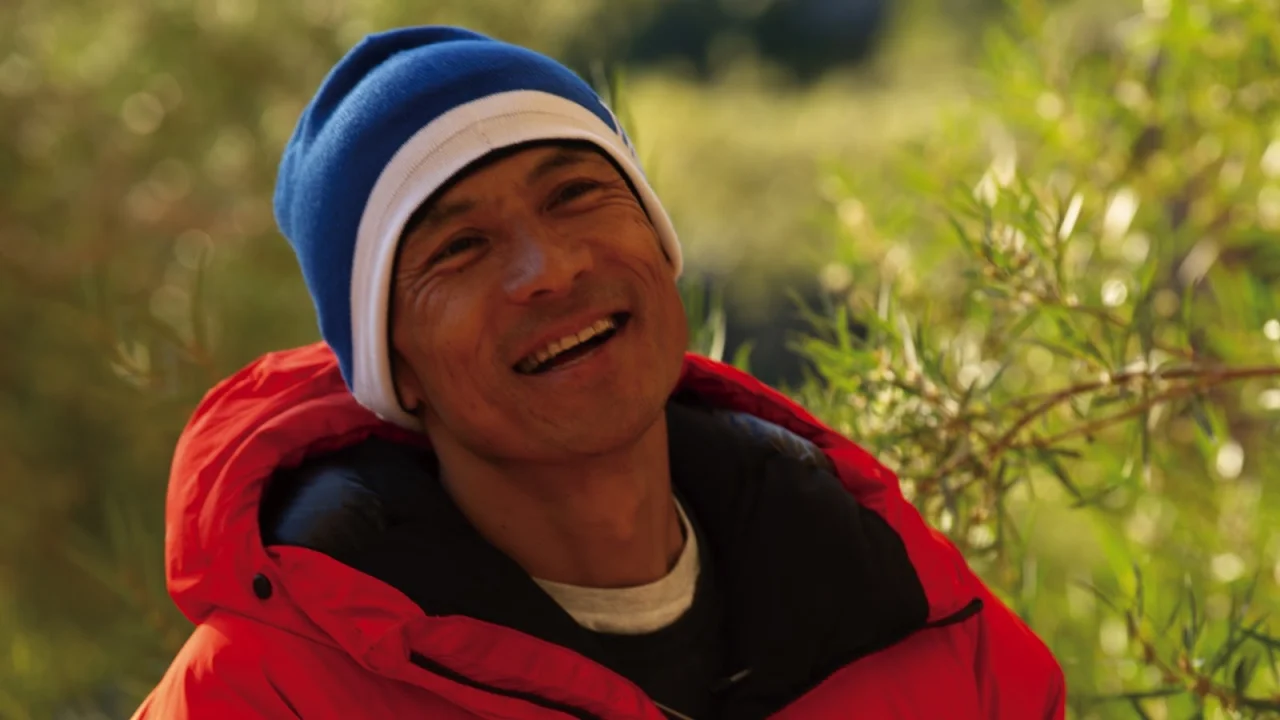 笑顔の平山ユージさん(映画『ENROUTE/エンルート』より)